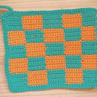 スウェーデンで見つけた手編みのポットマット（グリーン＆オレンジ）の商品写真